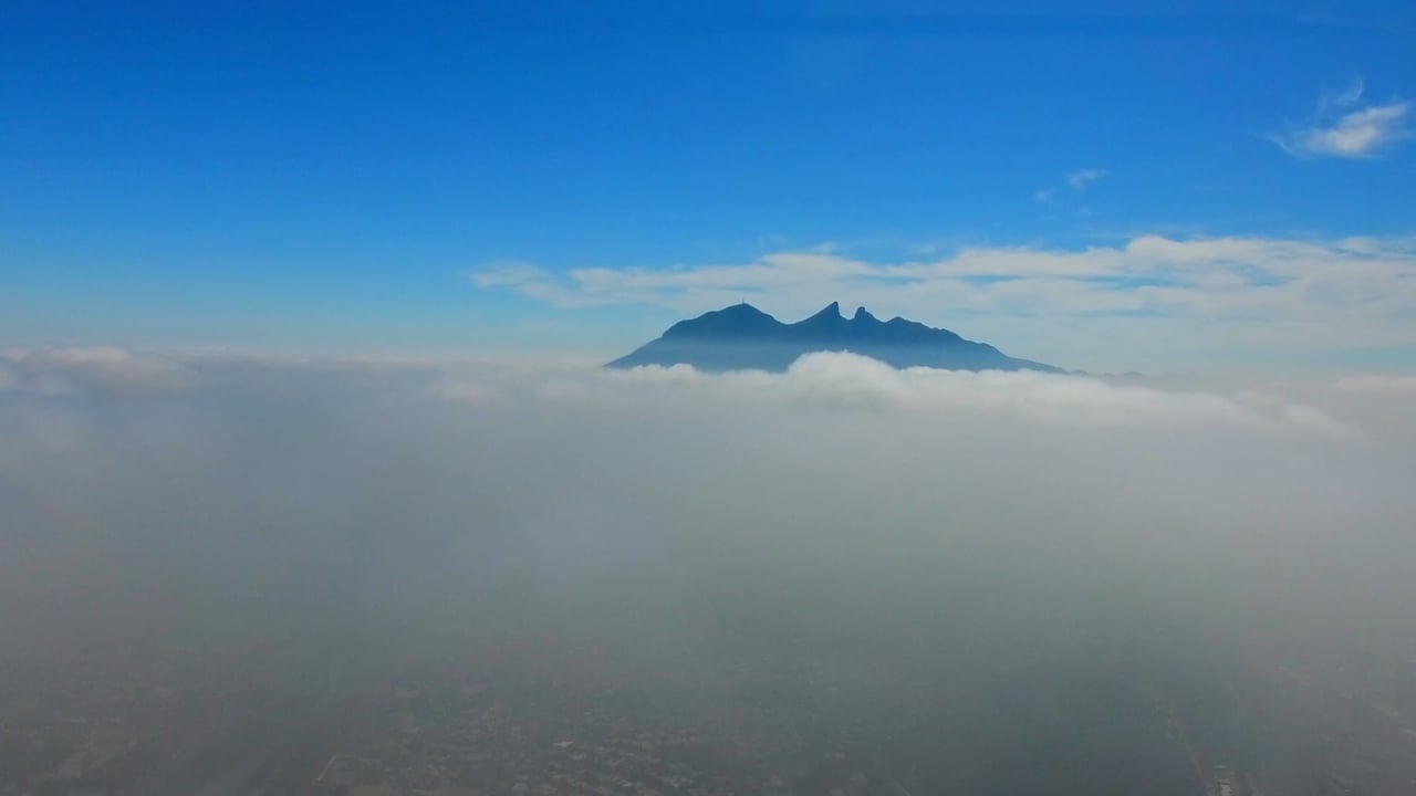 Cerro de la Silla rising above the haze over Monterrey